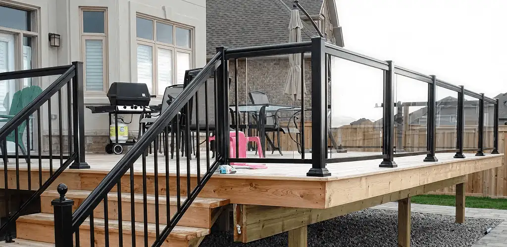 Handrail installation on a deck staircase for safety and code compliance in Newark, NJ