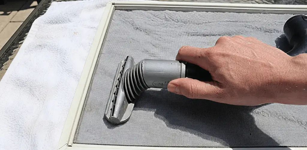 Window screen repair cleaning and fixing a damaged screen mesh in Newark, NJ