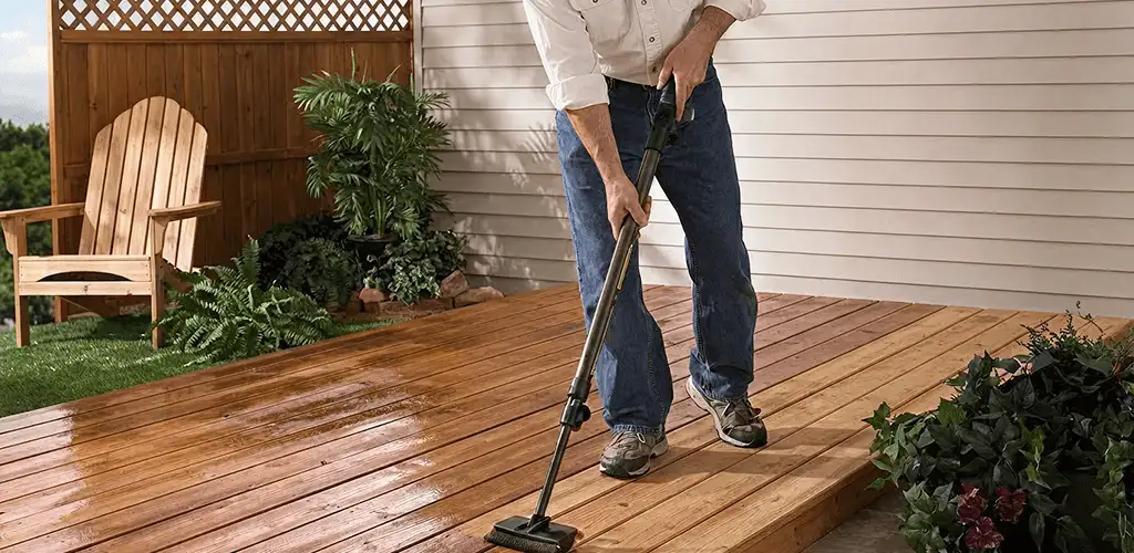 Deck staining service applying stain to a backyard wood deck in Newark, NJ